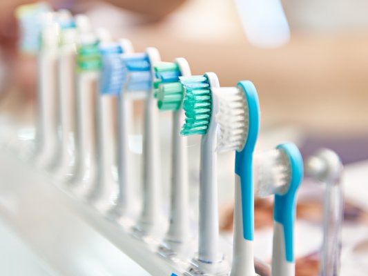 Electric toothbrush heads in a row
